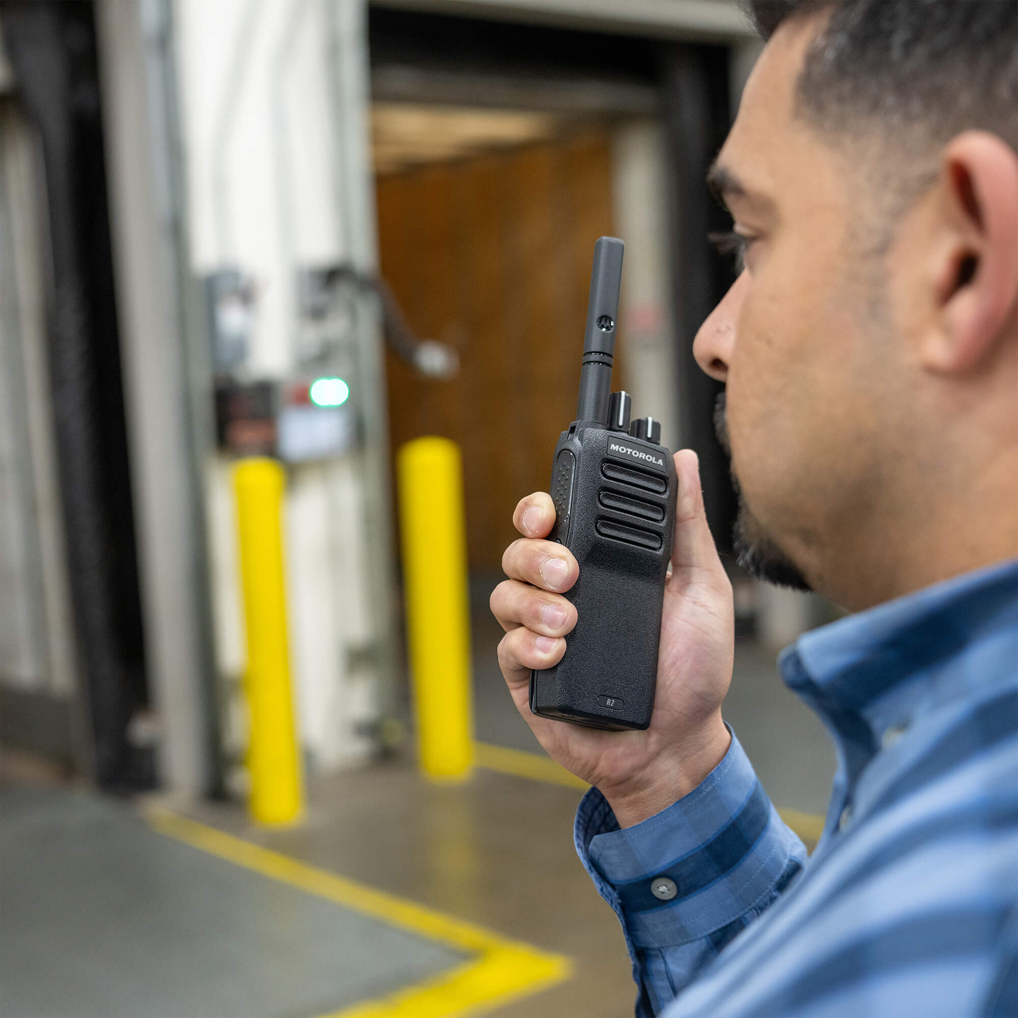 Motorola Solutions MOTOTRBO R2 portable two-way radio with analog and digital communication, push-to-talk functionality, rugged lightweight design, and reliable team connectivity for construction, manufacturing, security, and business operations