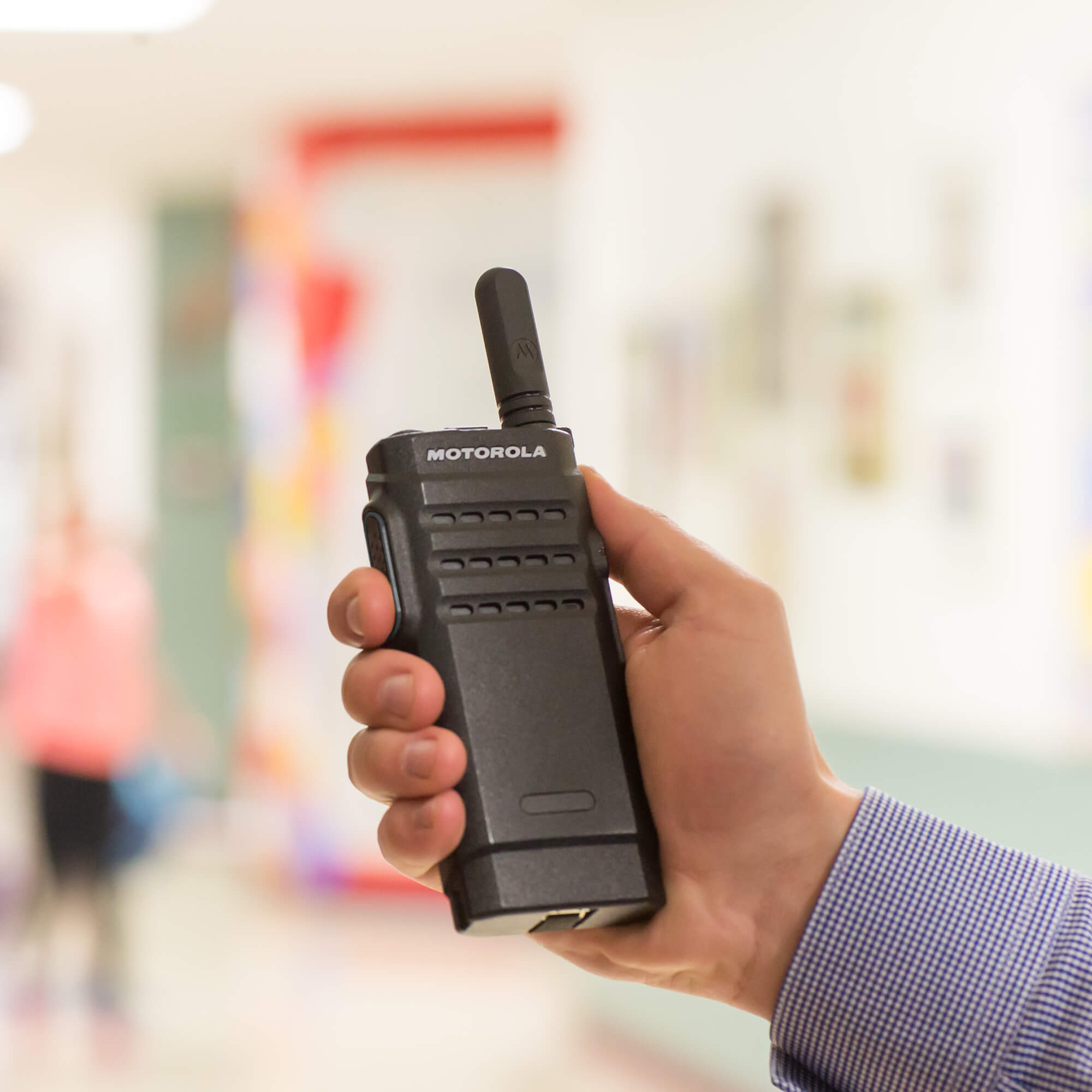 Motorola Solutions MOTOTRBO SL300 slim portable digital two-way radio with push-to-talk functionality, lightweight design, and reliable team communication for retail, hospitality, security, education, and business operations